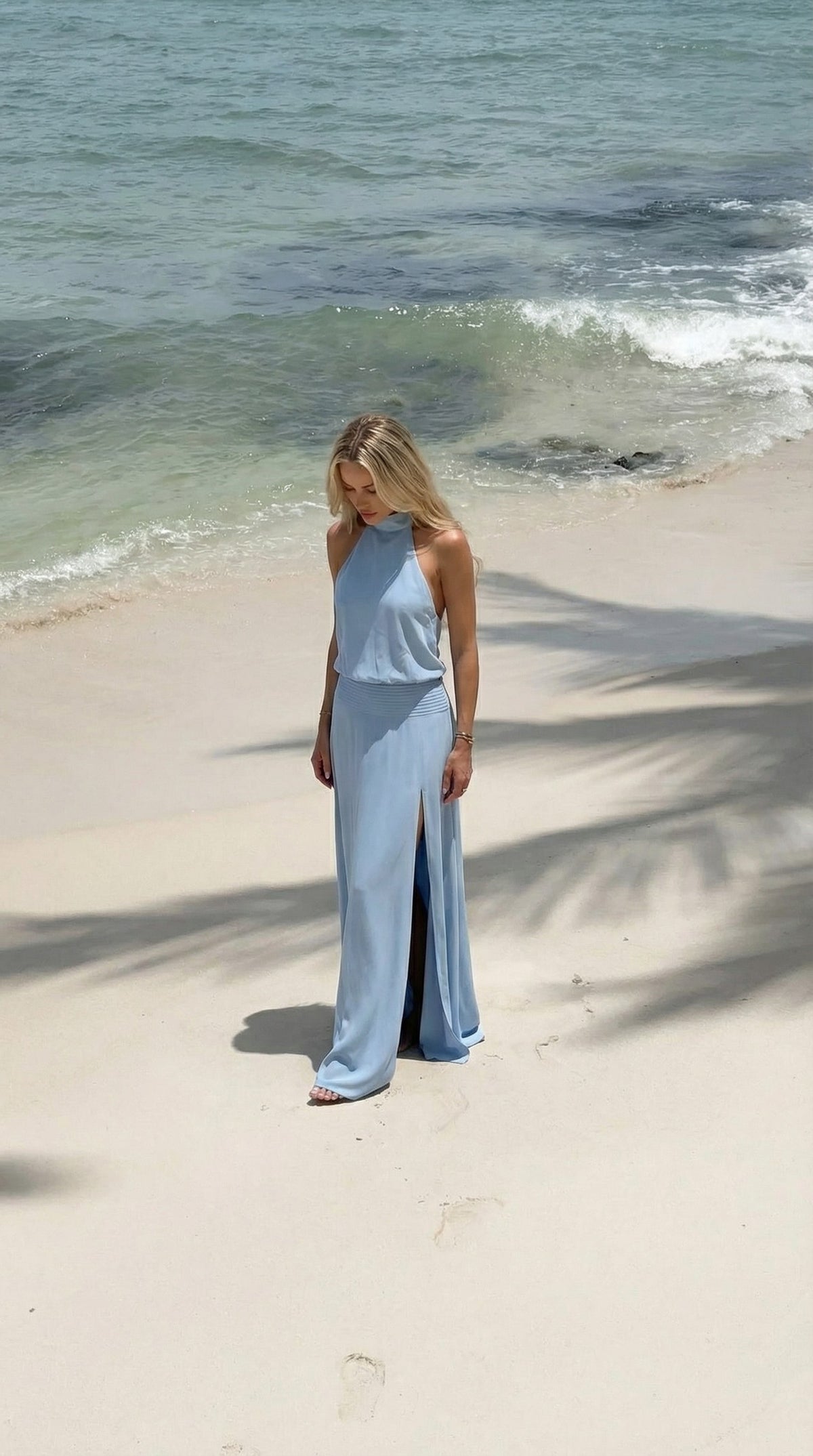Anna Dress, full-length view with front slit on the sand
