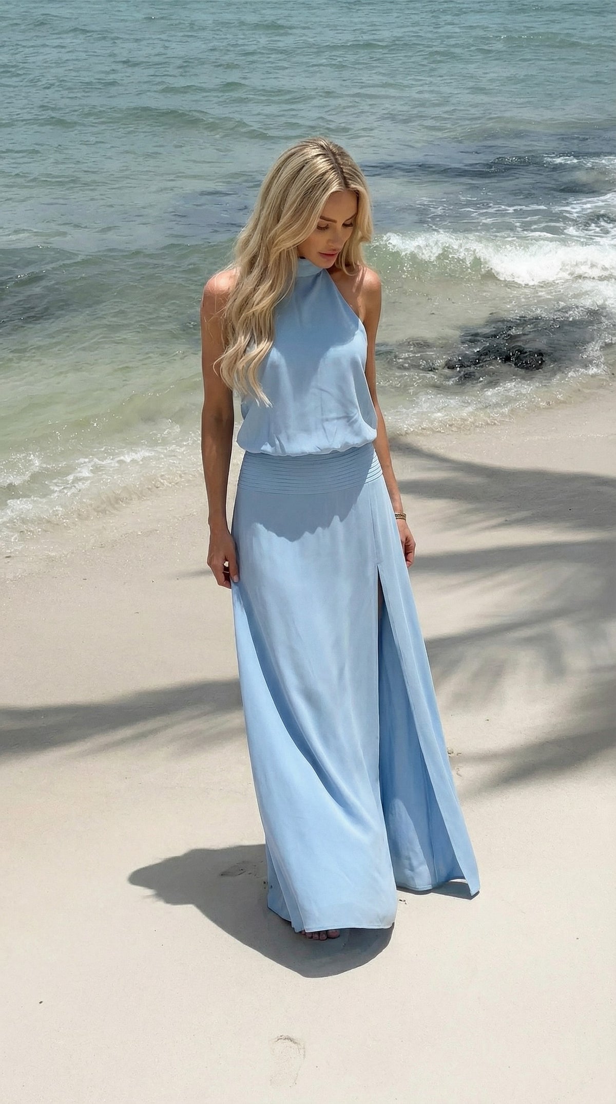 Anna Dress in powder blue on a beach, front view